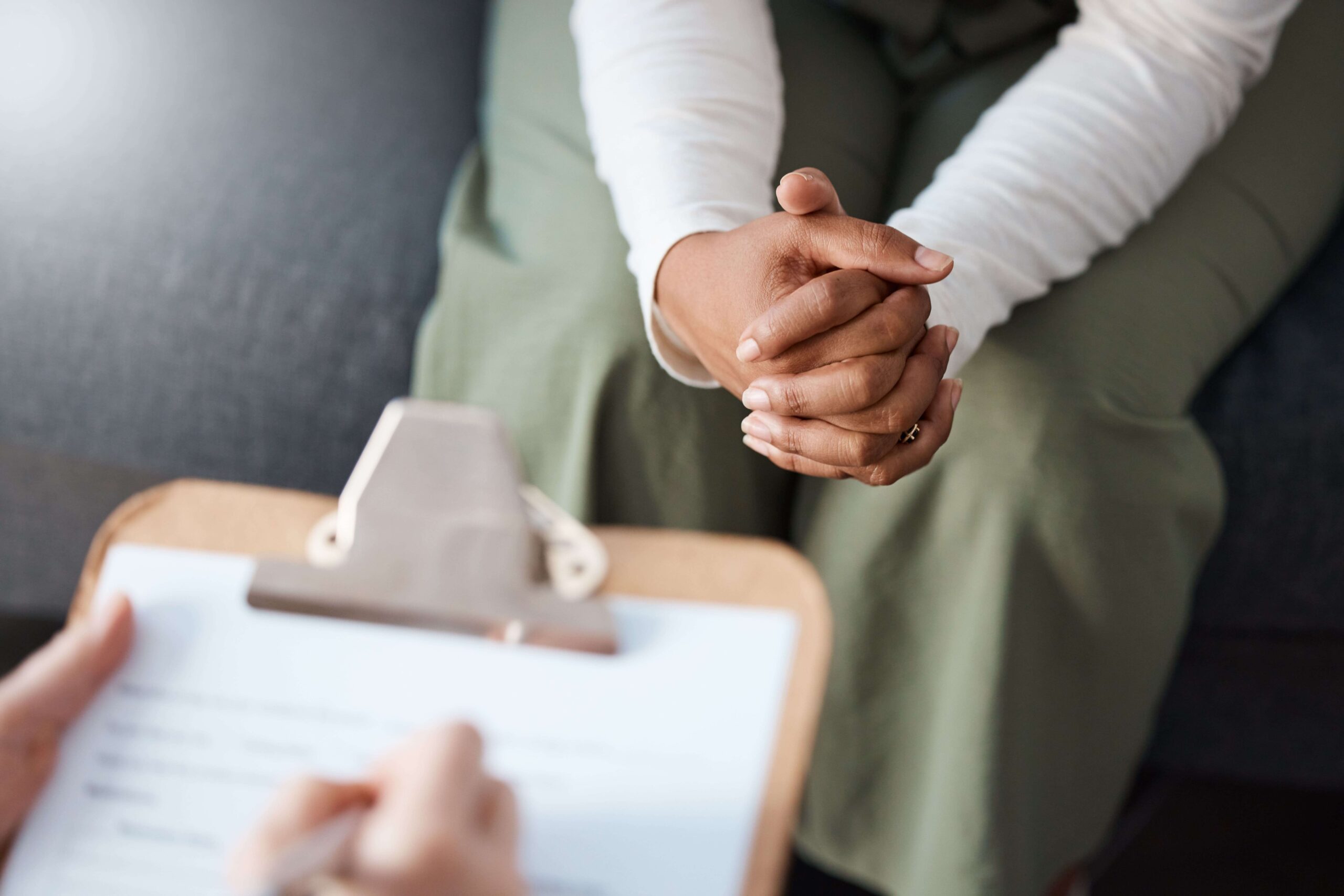 therapist filling out an insurance form for a patient