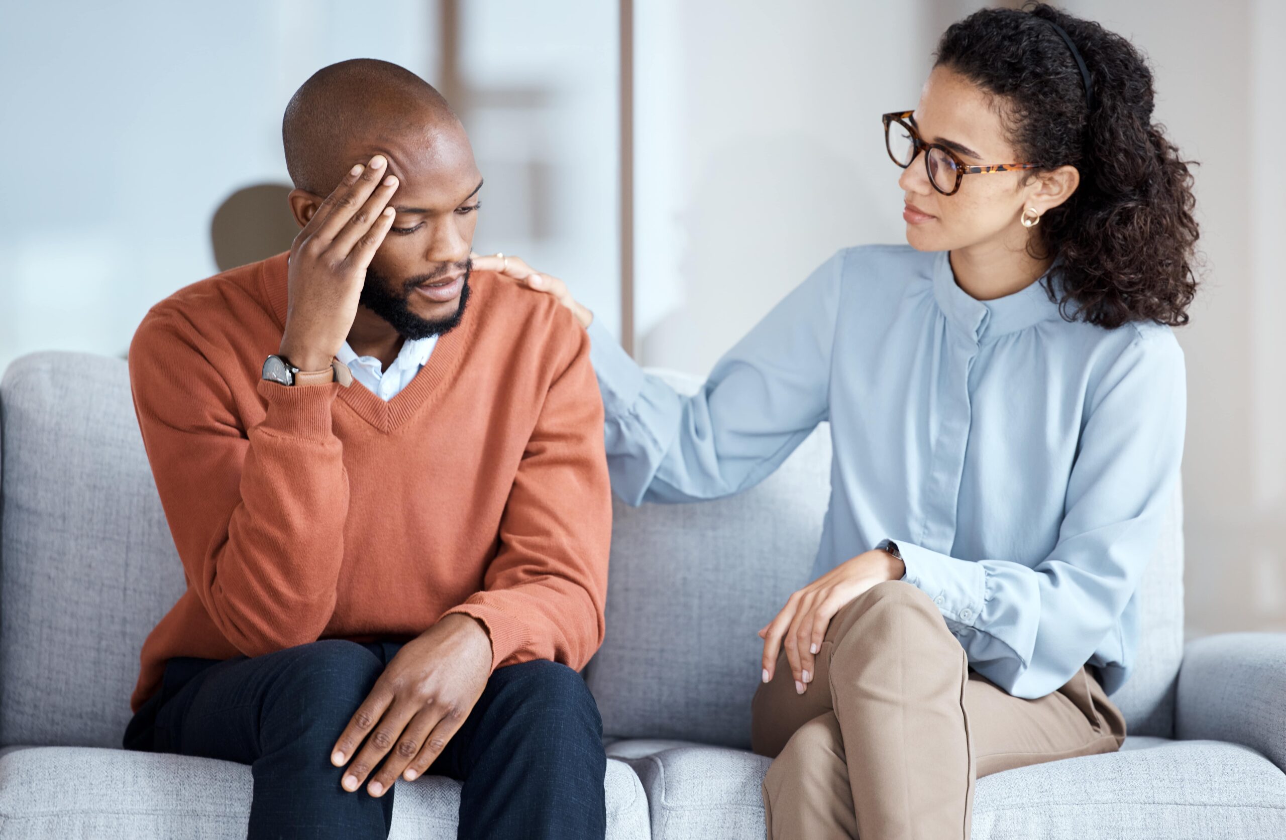 depressed man seeing a mental health counselor