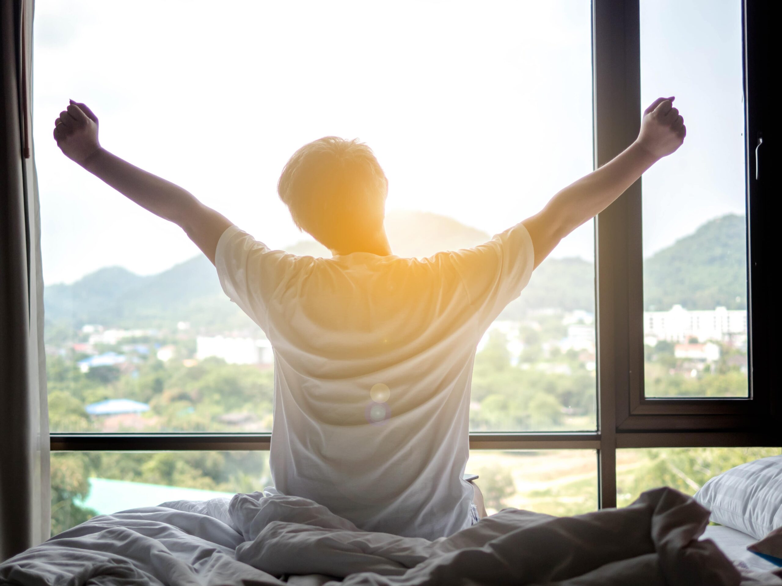 man waking up after a good night’s sleep